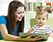 Child listening to a narrated story on a tablet